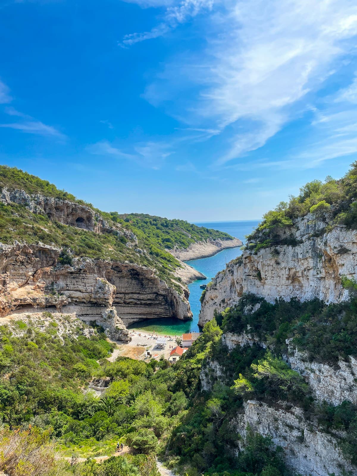 Stiniva Beach on Vis Island Croatia with narrow cliff entrance and turquoise water