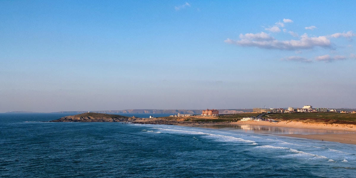 Fistral Beach Newquay with waves and the Headland Hotel in the distance