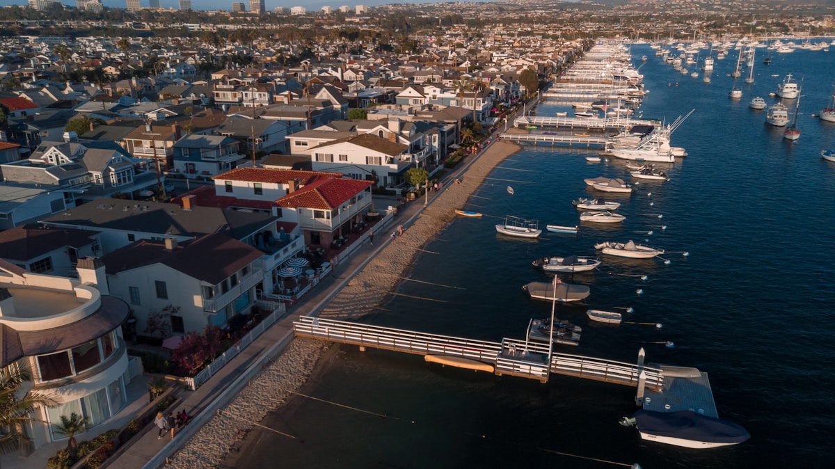 Aerial view of Newport Beach harbor with boats and Balboa Island
