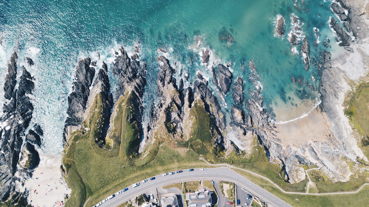 Aerial view of Woolacombe Beach Devon with turquoise water and rocky coastline